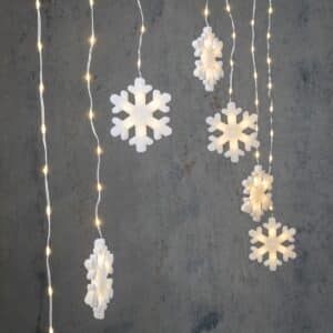 Lysgardin med snefnug